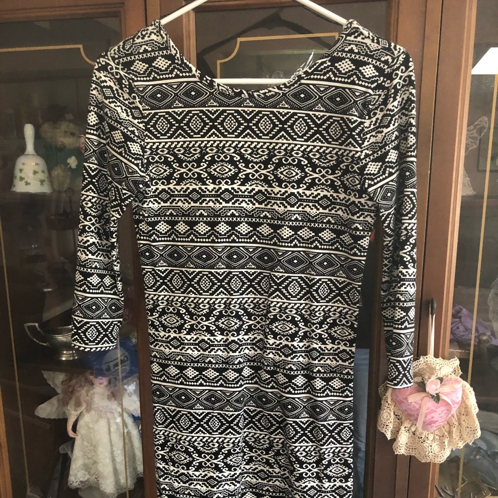 Southwestern print mini dress. Hem sits about an inch 1/2 above the knee.